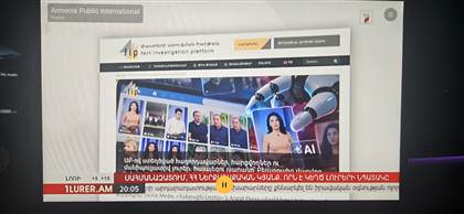 MultiWave on a car head unit, TV tab playing Armenian news